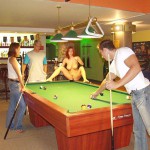 At a small billiard bar
