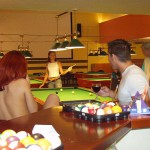 At a small billiard bar