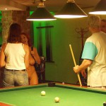At a small billiard bar