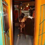 Inside and in font of small bar