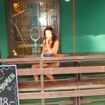 Inside and in font of small bar