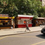 At a bus stop and at a kiosk