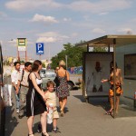 At a bus stop and at a kiosk