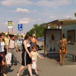 At a bus stop and at a kiosk