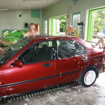 In a garage with a washing bay
