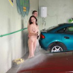 In a garage with a washing bay