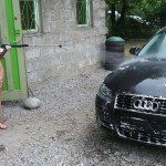 In a garage with a washing bay