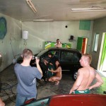 In a garage with a washing bay