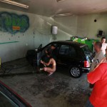 In a garage with a washing bay