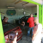 In a garage with a washing bay