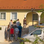 Handing out beers to construction workers