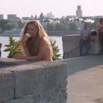 At one end of a railway bridge