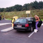At a big gas station with a car wash