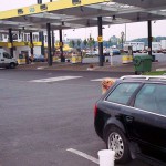 At a big gas station with a car wash