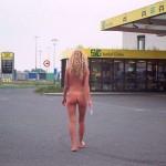 At a big gas station with a car wash