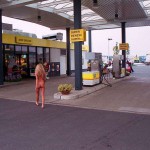 At a big gas station with a car wash