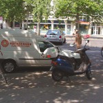 At a kiosk and in front of a street