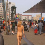 At an open square giving away balloons