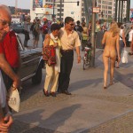 At an open square giving away balloons