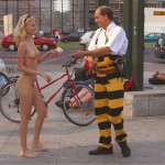 At an open square giving away balloons