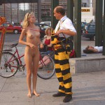 At an open square giving away balloons