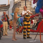 At an open square giving away balloons