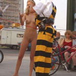 At an open square giving away balloons