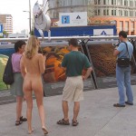 At an open square giving away balloons