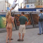 At an open square giving away balloons