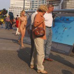 At an open square giving away balloons