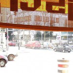 In a bistro with a big window