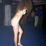 At a public party in a disco