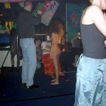 At a public party in a disco