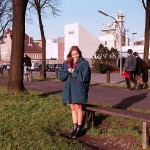 On a green area next to the river bank