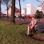 On a green area next to the river bank