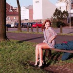 On a green area next to the river bank