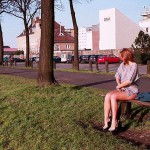 On a green area next to the river bank