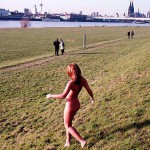 On a green area next to the river bank