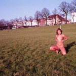 On a green area next to the river bank