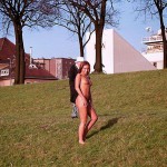 On a green area next to the river bank