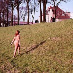 On a green area next to the river bank