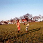 On a green area next to the river bank