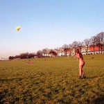 On a green area next to the river bank