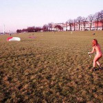 On a green area next to the river bank