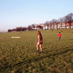 On a green area next to the river bank