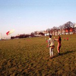 On a green area next to the river bank