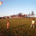 On a green area next to the river bank