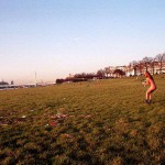 On a green area next to the river bank