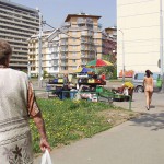 A fruit stand at a well frequented crossing