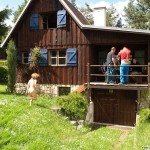 At a holiday home and in a bar with some friends